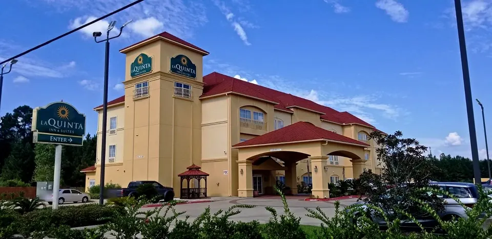 Before: the hotel in its original yellow scheme, with the entrance sign and tower