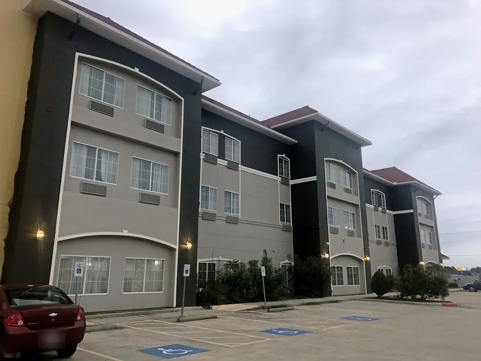 After: the hotel repainted in gray and charcoal with white trim