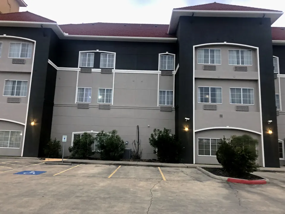 After: a three-story wing in the new gray and charcoal scheme