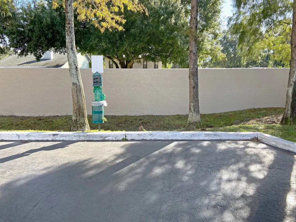 Painted perimeter wall by the parking lot