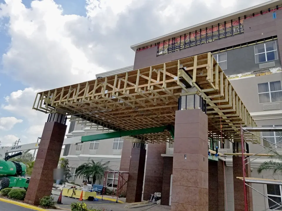 Wood trusses framing the canopy roof