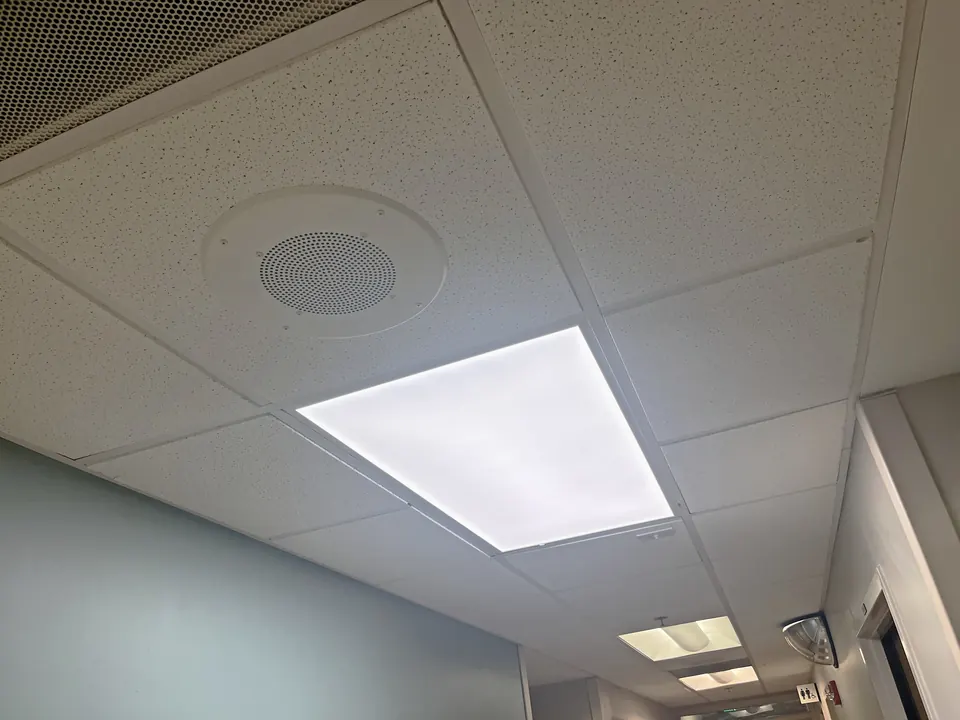 New 2x4 LED flat panel installed in the corridor ceiling grid