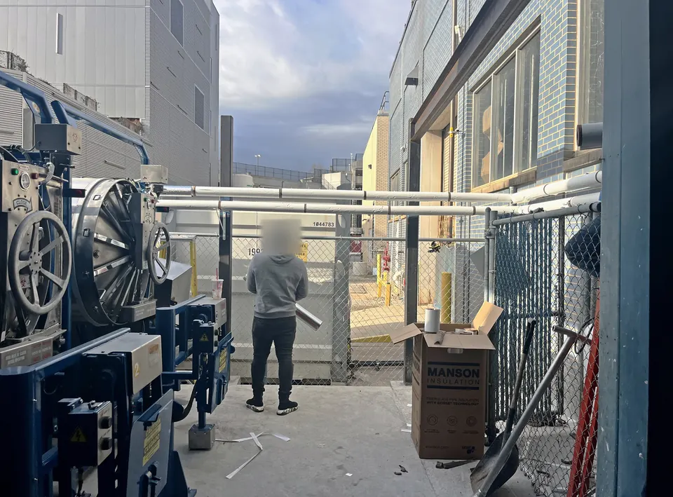 Utility connections being run to the unit under the canopy