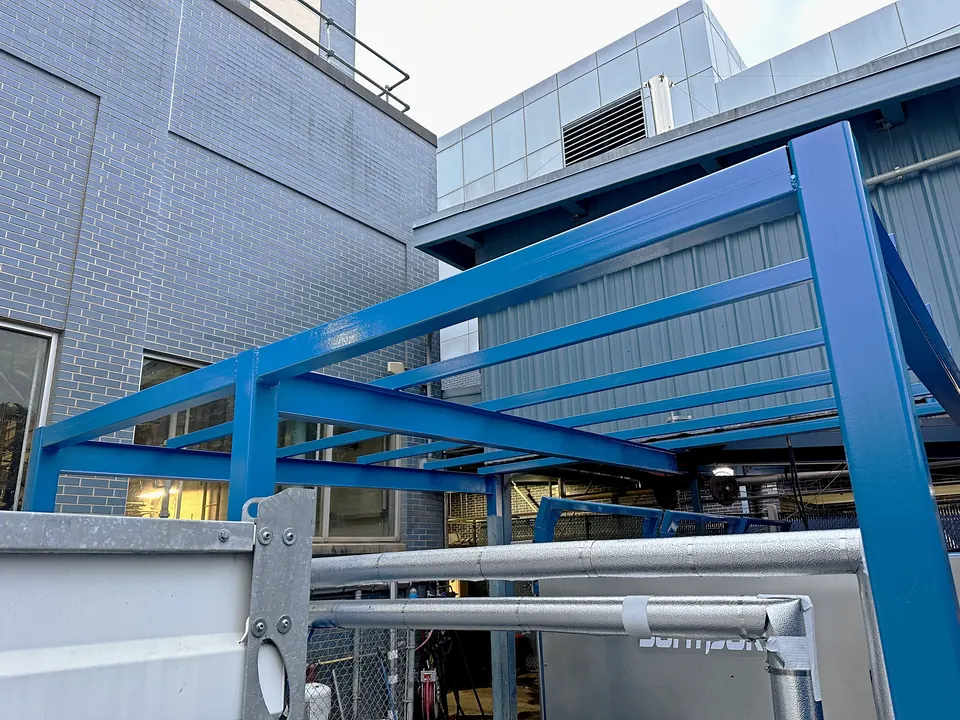 Painted canopy beams and insulated utility piping