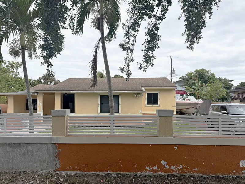 Before: faded yellow paint and a peeling orange front wall